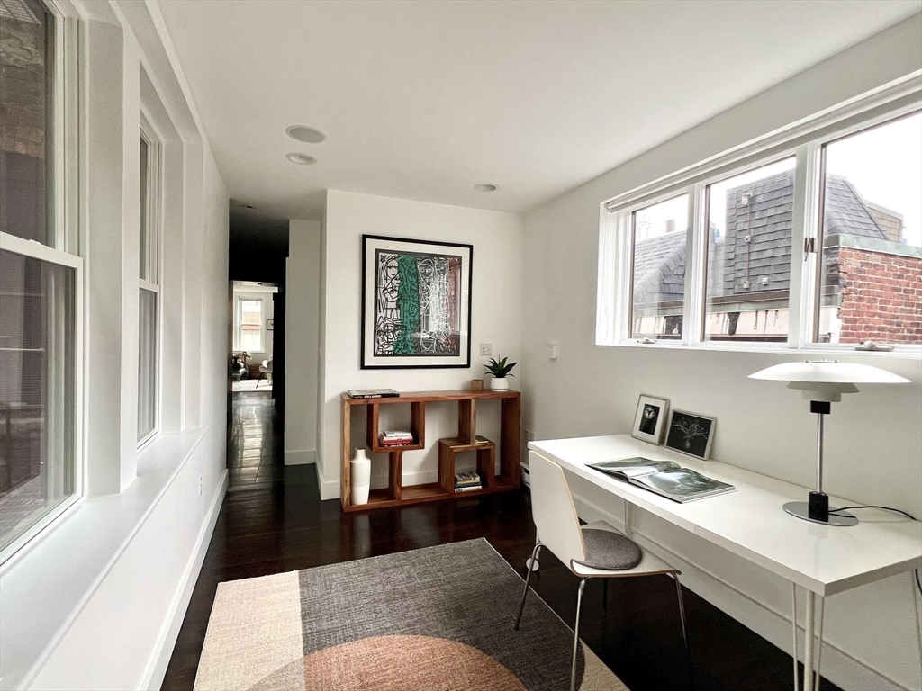 15 Charter Street, Unit 4 Boston, MA 02113 - Photo 20 of 42 a living room with furniture and a window