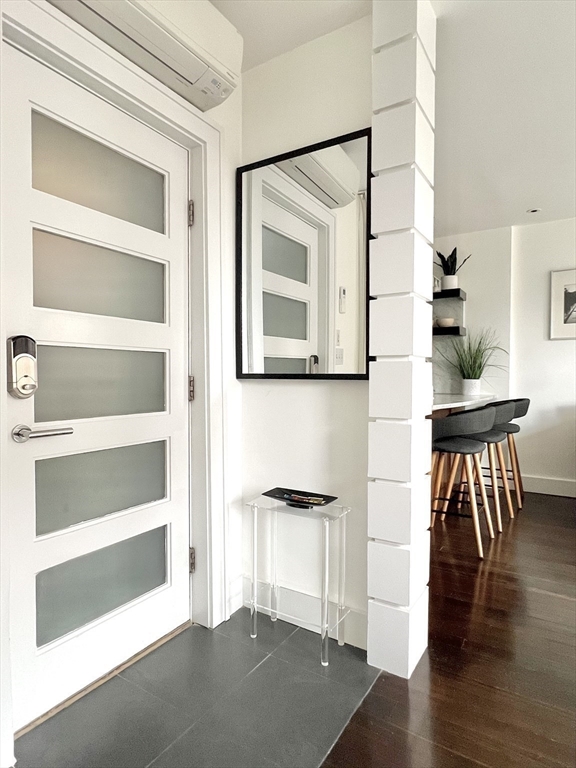 15 Charter Street, Unit 4 Boston, MA 02113 - Photo 2 of 42 a view of a hallway with wooden floor and windows