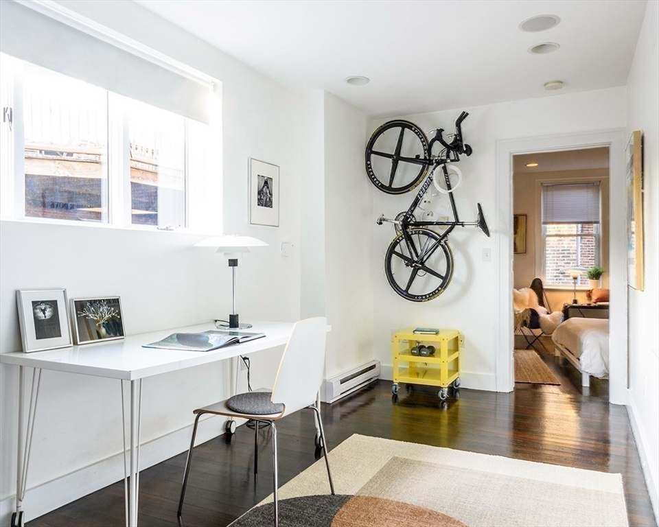 15 Charter Street, Unit 4 Boston, MA 02113 - Photo 22 of 42 a view of a livingroom with furniture and wooden floor