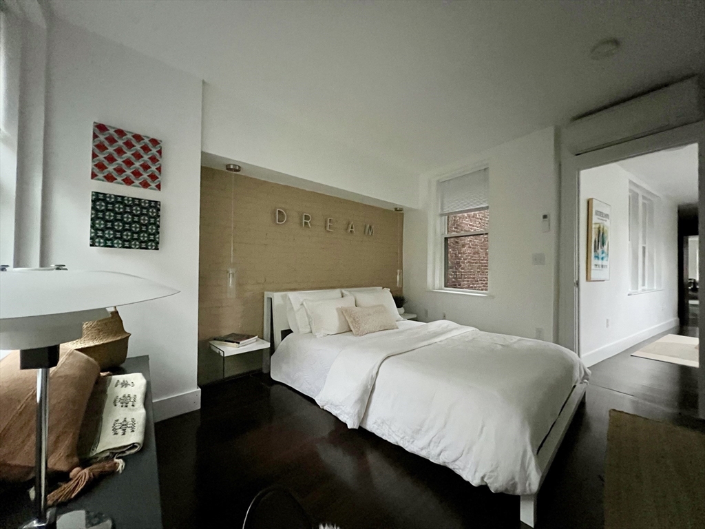 15 Charter Street, Unit 4 Boston, MA 02113 - Photo 23 of 42 a bedroom with a bed and wooden floor