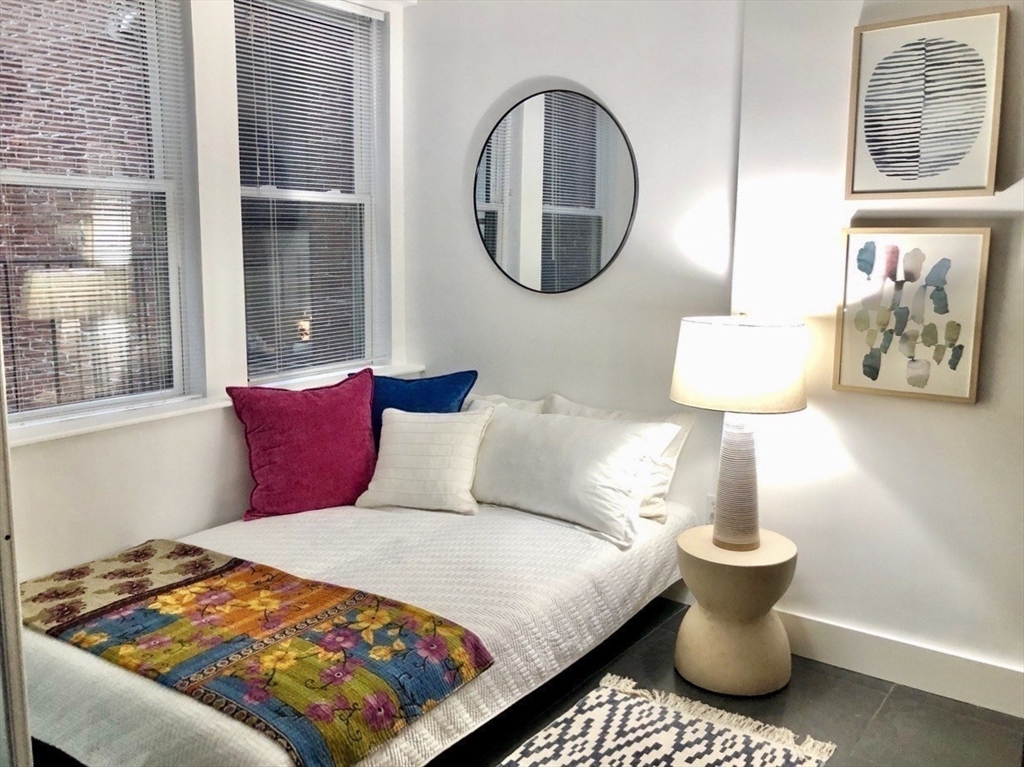 15 Charter Street, Unit 4 Boston, MA 02113 - Photo 33 of 42 a bedroom with a bed and a painting on the wall
