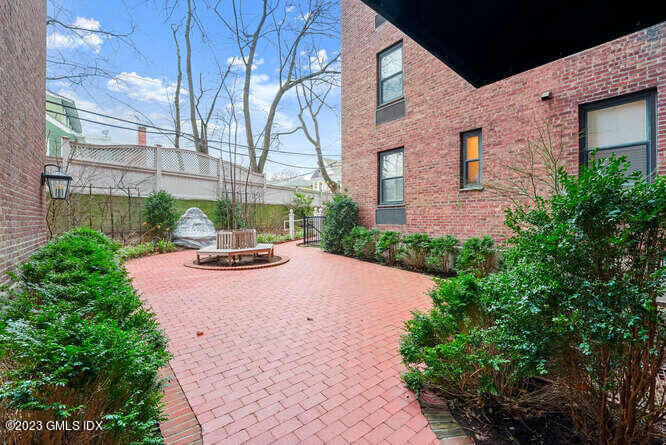 25 West Elm Street, Unit 40 Greenwich, CT 06830 - Photo 24 of 28 a view of a street with a building in the background