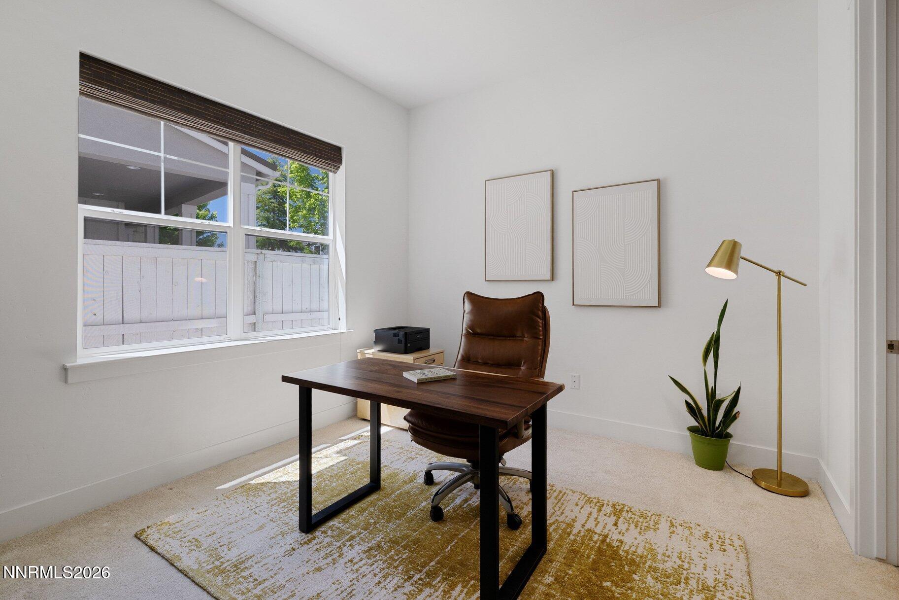 6110 South Pleasant Oak Trail Reno, NV 89511 - Photo 24 of 66 a view of a workspace with furniture and a window