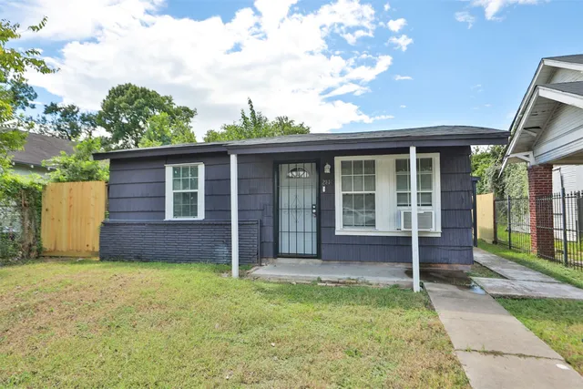 front view of a house with a yard