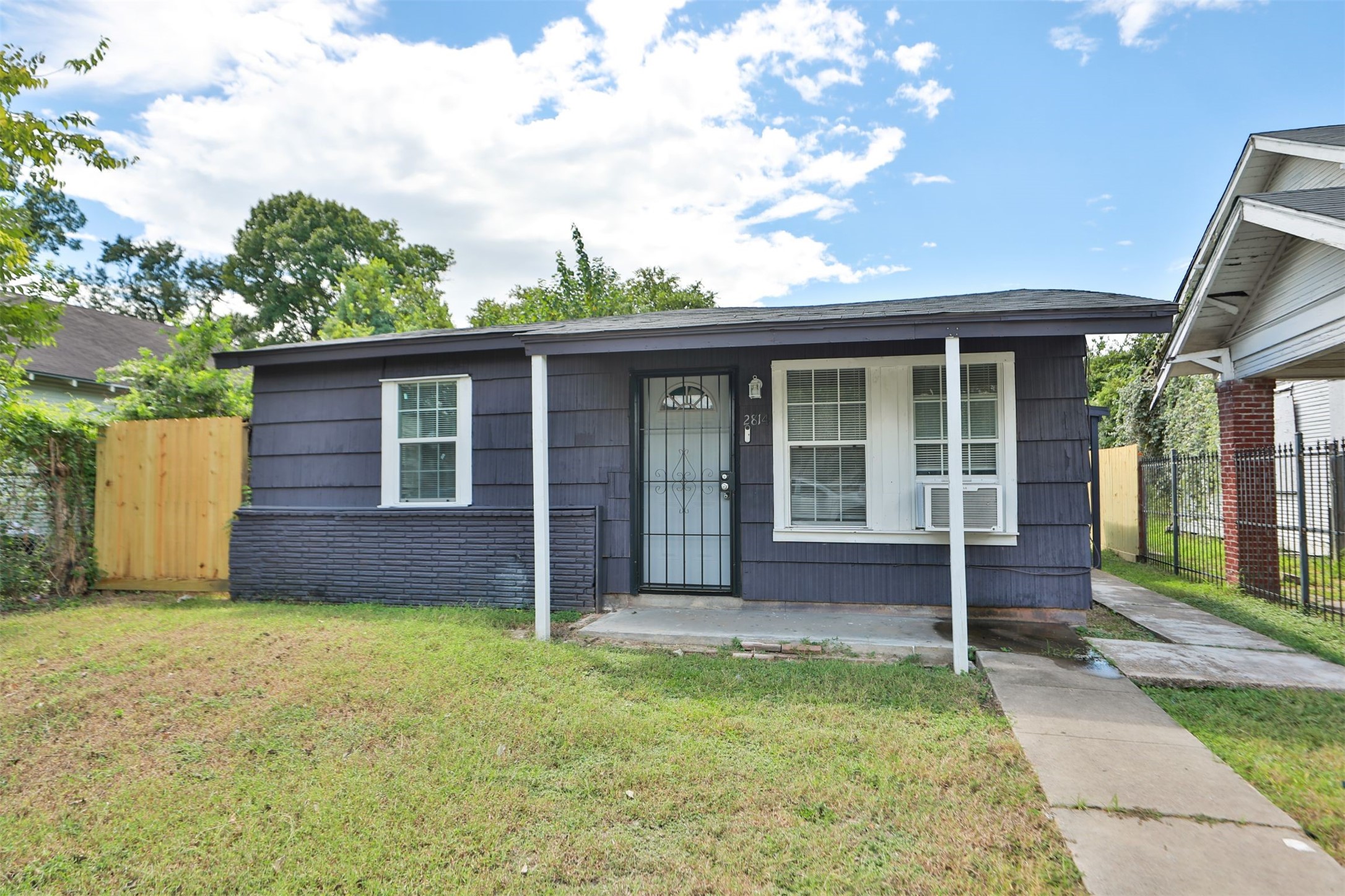 front view of a house with a yard