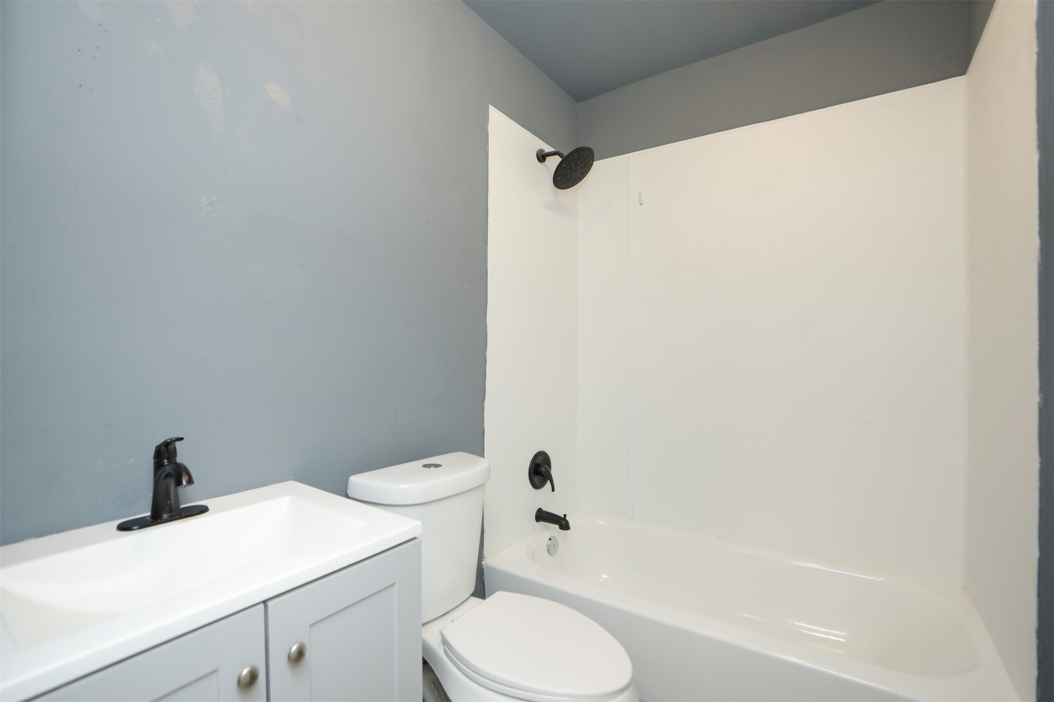 2814 Winbern Street Houston, TX 77004 - Photo 15 of 21 a bathroom with a sink toilet and shower
