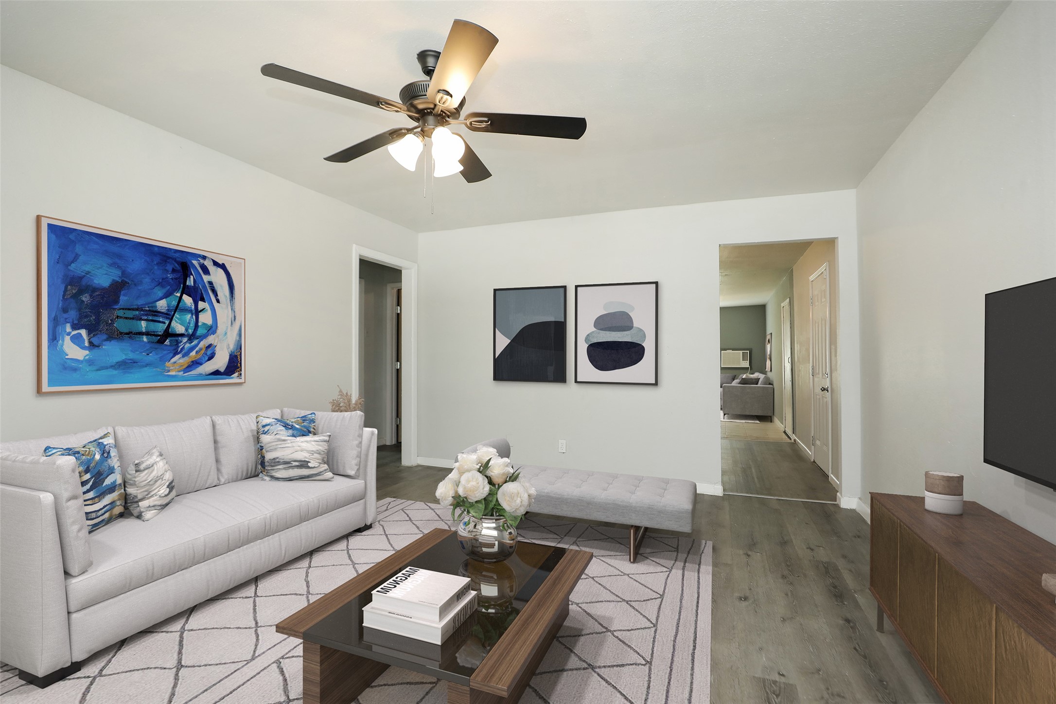 2814 Winbern Street Houston, TX 77004 - Photo 4 of 21 a living room with furniture and a flat screen tv