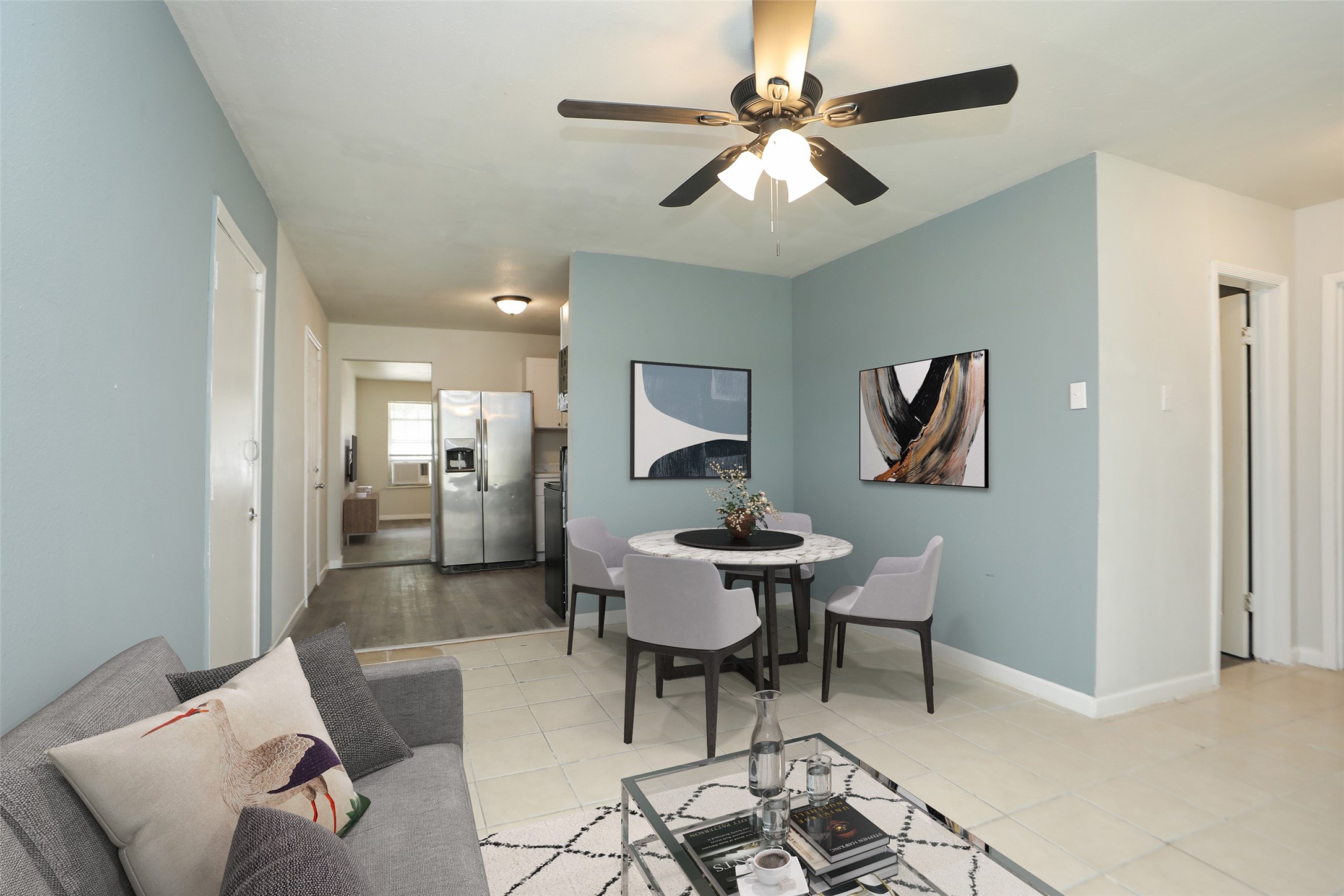 2814 Winbern Street Houston, TX 77004 - Photo 8 of 21 a living room with furniture and a chandelier