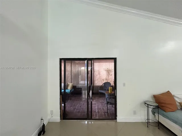 a view of swimming pool with chairs in patio