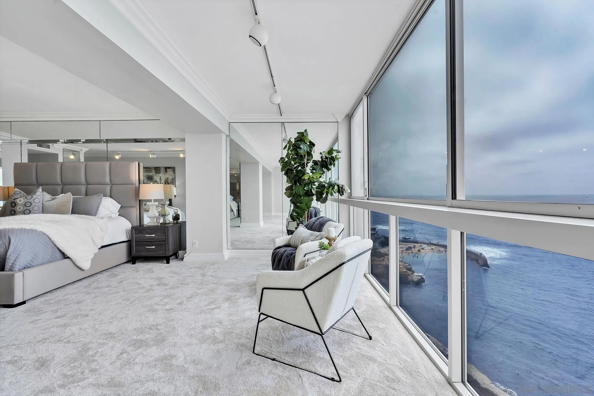 939 Coast Boulevard, Unit 12C La Jolla, CA 92037 - Photo 12 of 41 a living room with furniture and a potted plant