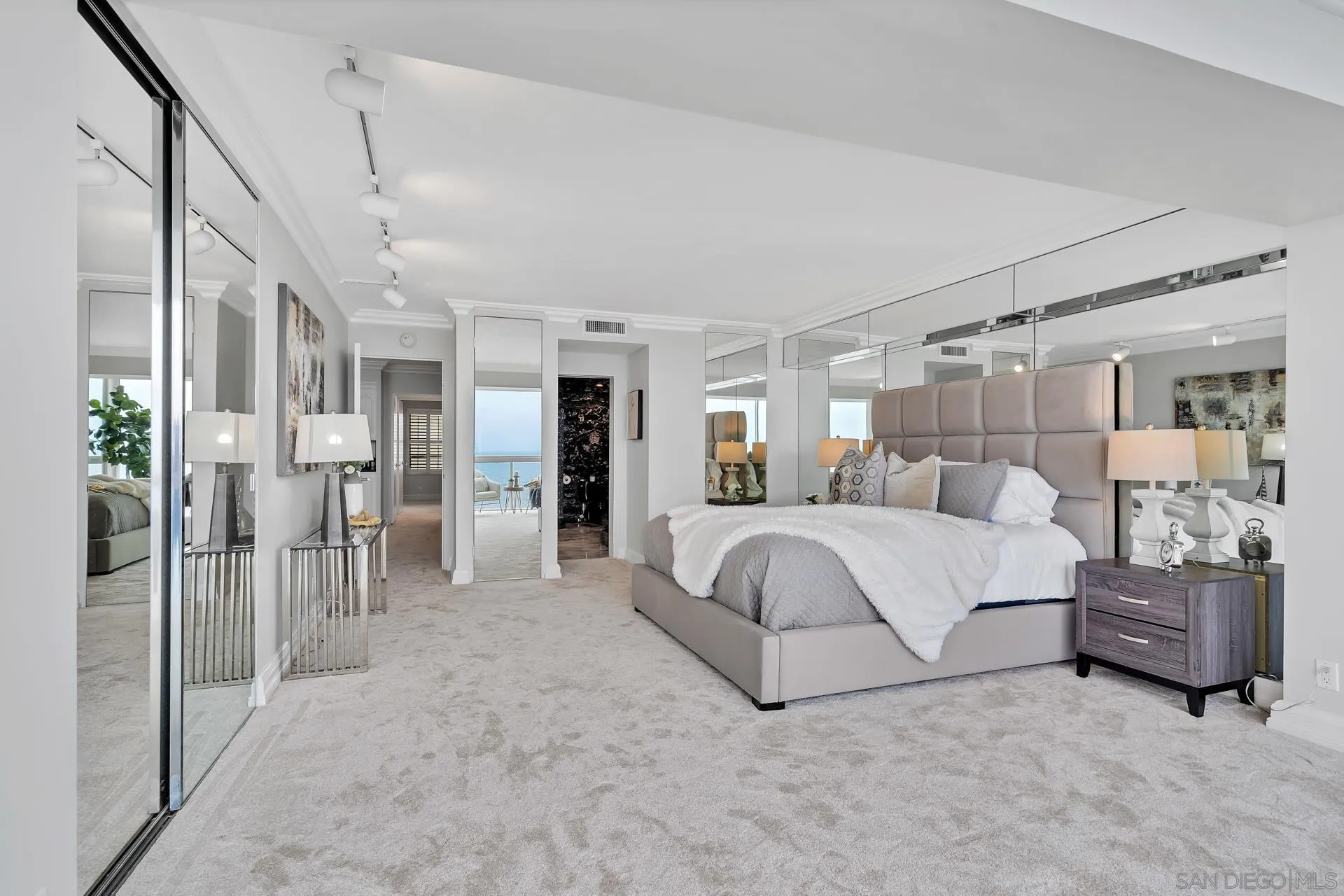 939 Coast Boulevard, Unit 12C La Jolla, CA 92037 - Photo 20 of 41 a bedroom with a large bed and furniture