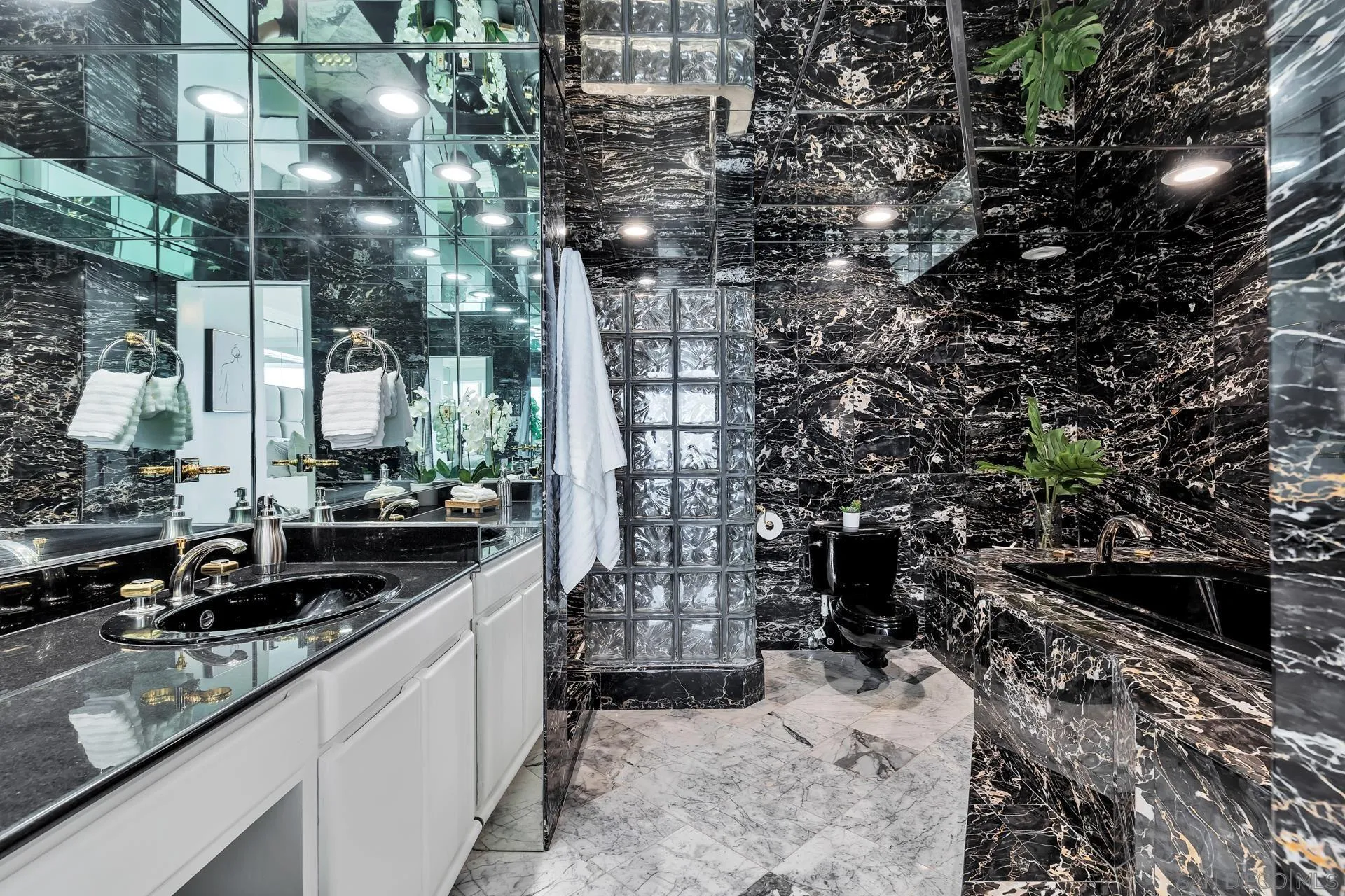 939 Coast Boulevard, Unit 12C La Jolla, CA 92037 - Photo 23 of 41 a view of a pathway that has couple of cars parked in front of it