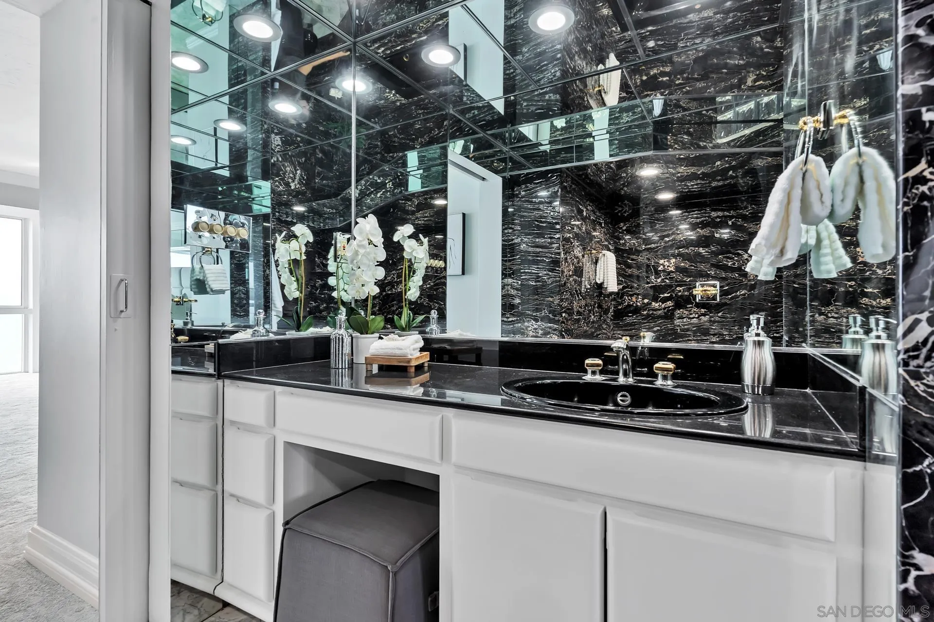 939 Coast Boulevard, Unit 12C La Jolla, CA 92037 - Photo 26 of 41 a kitchen with a sink and cabinets