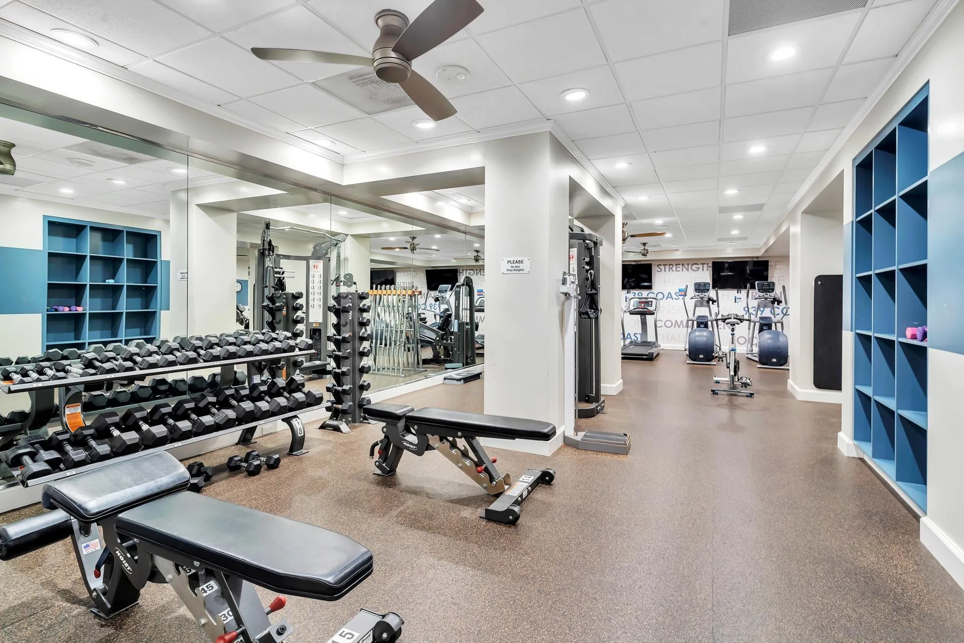 939 Coast Boulevard, Unit 12C La Jolla, CA 92037 - Photo 34 of 41 a room with lots of furniture and gym equipment