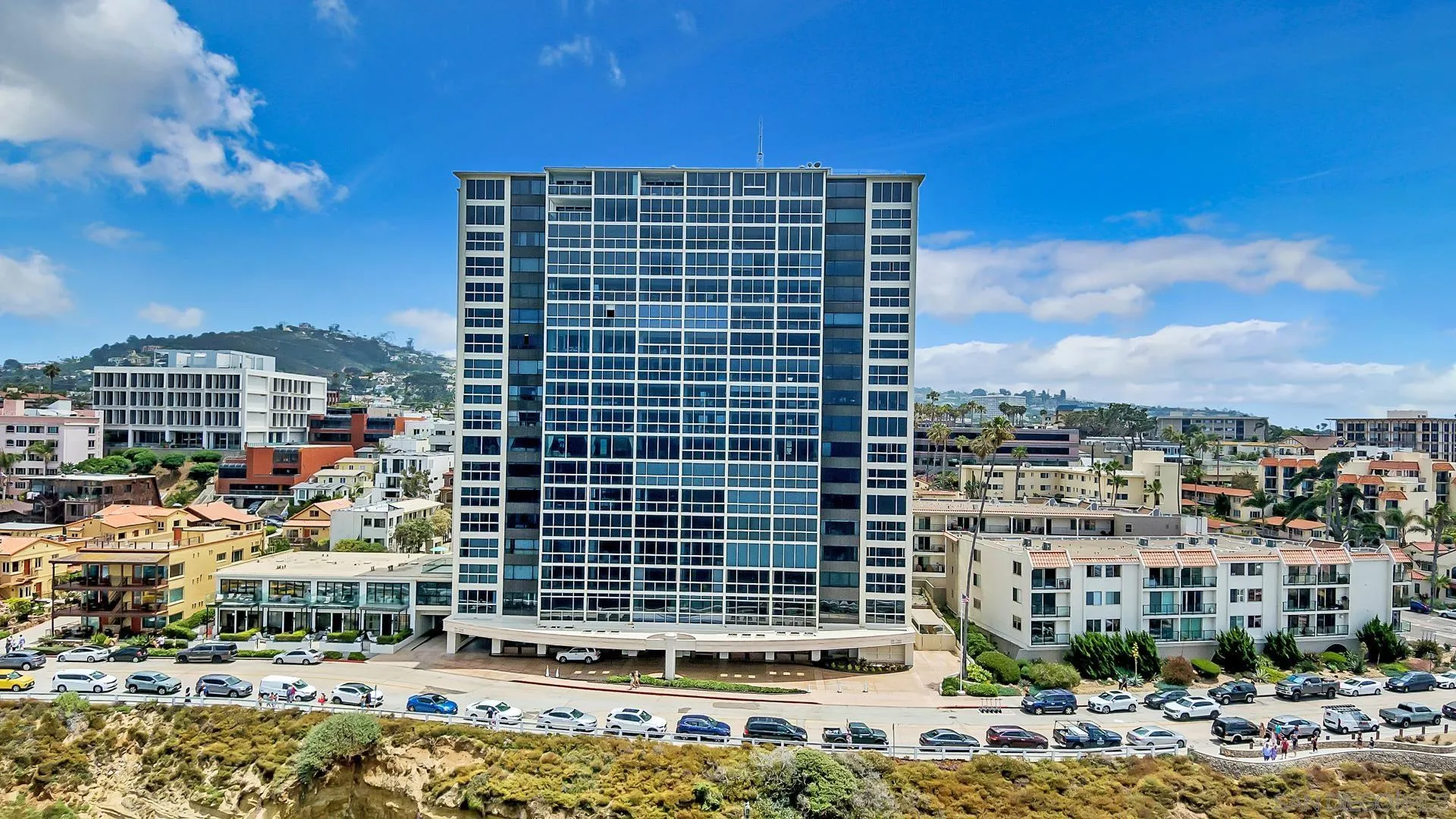 939 Coast Boulevard, Unit 12C La Jolla, CA 92037 - Photo 41 of 41 a front view of a building with a yard