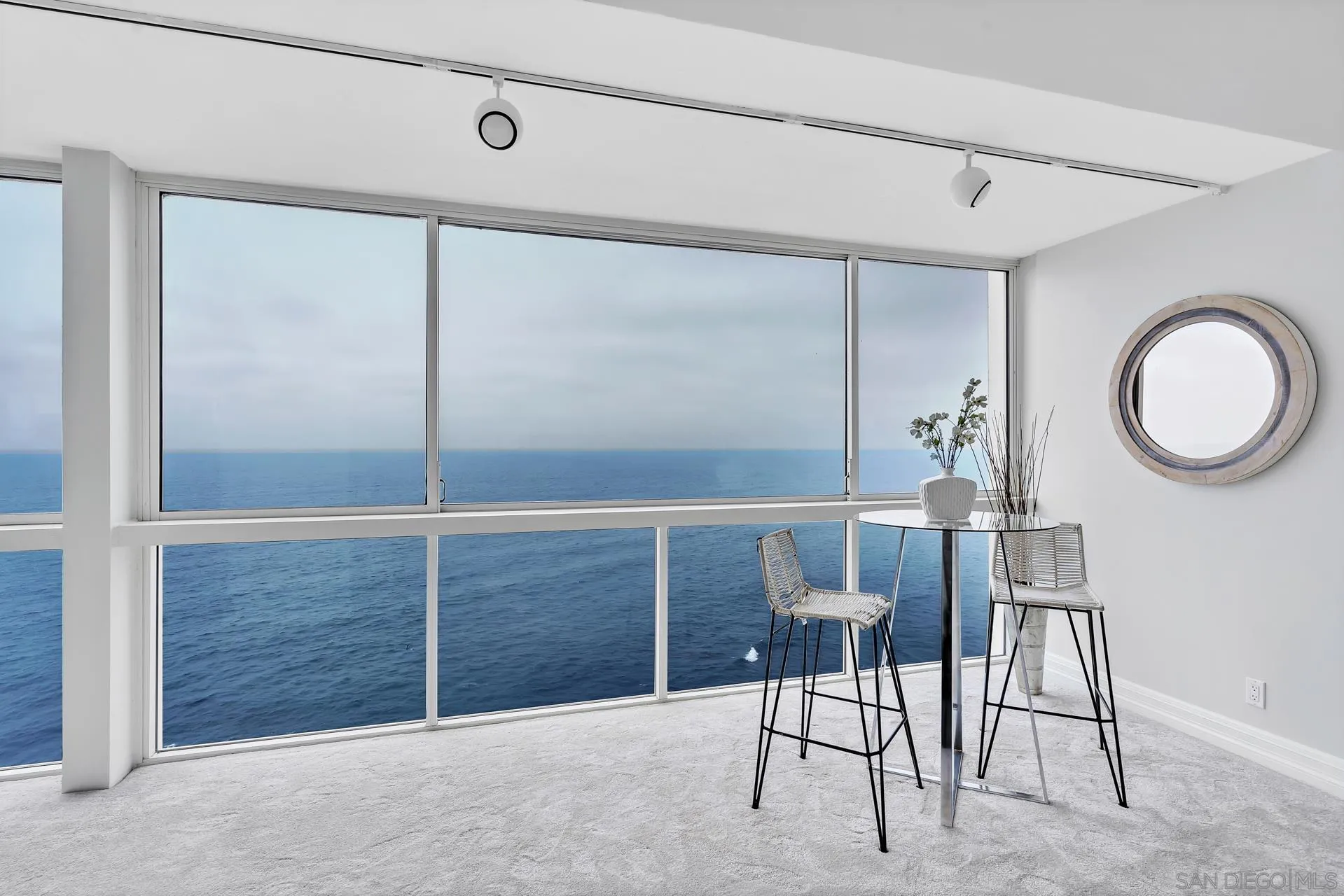 939 Coast Boulevard, Unit 12C La Jolla, CA 92037 - Photo 10 of 41 a view of a room that has a table and chairs in it