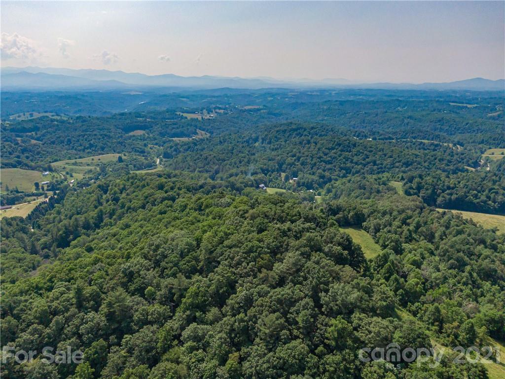 389 Winding Ridge Road, Unit 12 13 15 Marshall, NC 28753 - Photo 24 of 32 an aerial view of residential houses and outdoor space