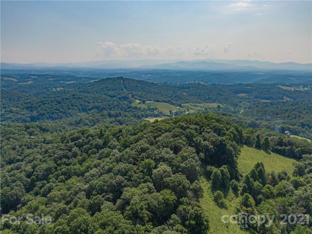 389 Winding Ridge Road, Unit 12 13 15 Marshall, NC 28753 - Photo 31 of 32 an aerial view of residential house and lake