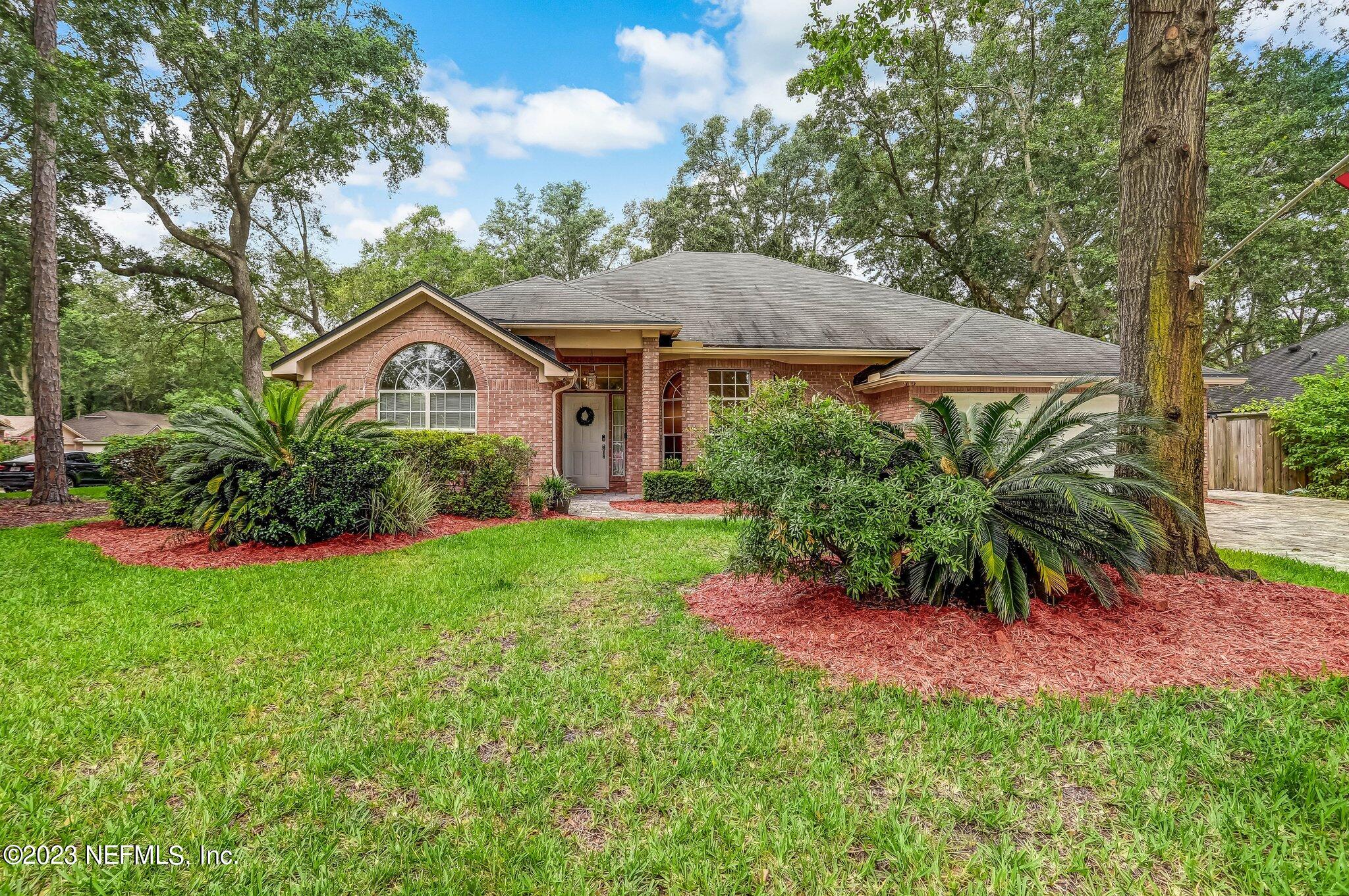 613 Hummingbird Court St. Johns, FL 32259 - Photo 1 of 29 a view of a house with a yard and plants