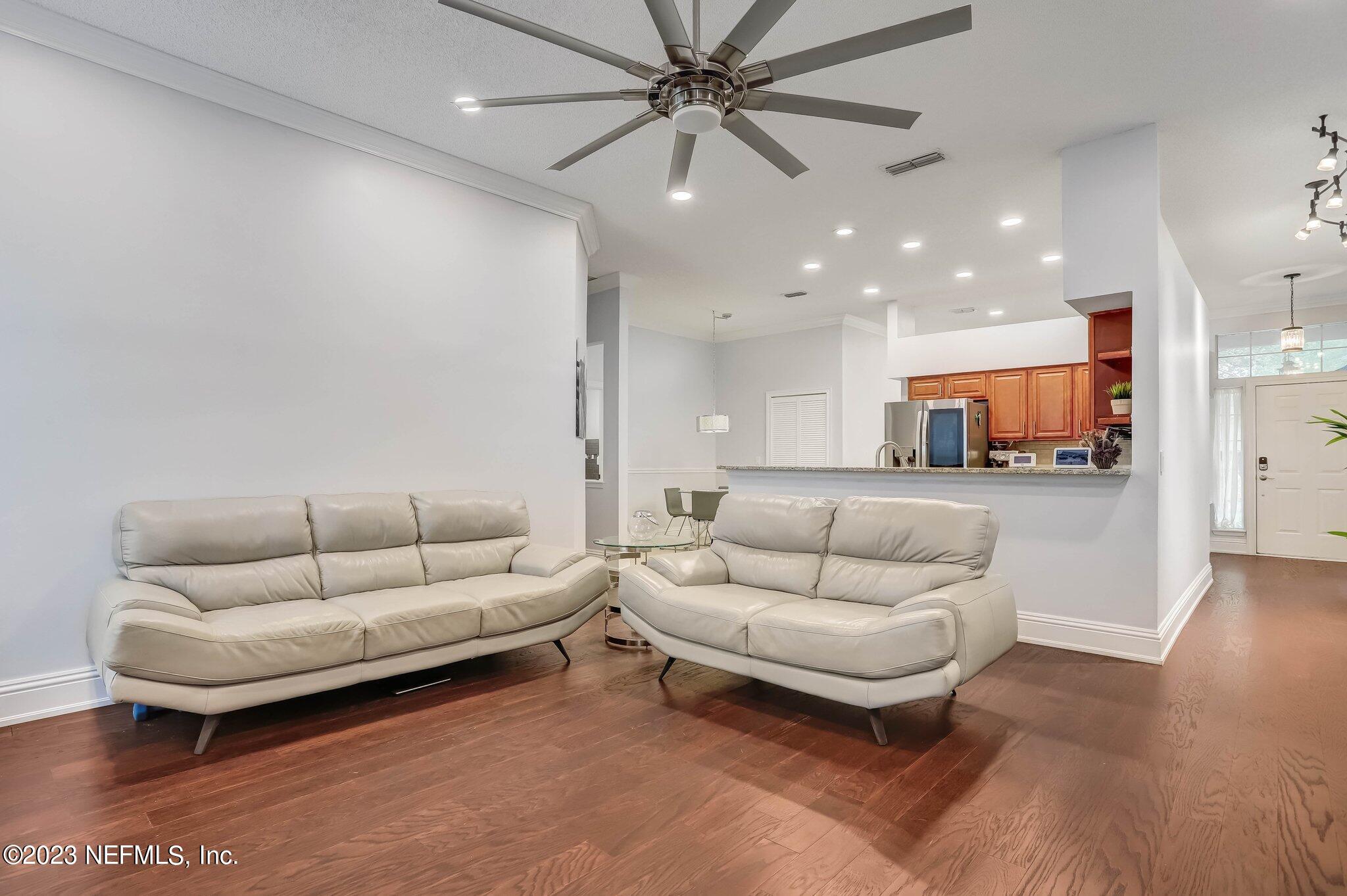 613 Hummingbird Court St. Johns, FL 32259 - Photo 13 of 29 a living room with furniture and kitchen view