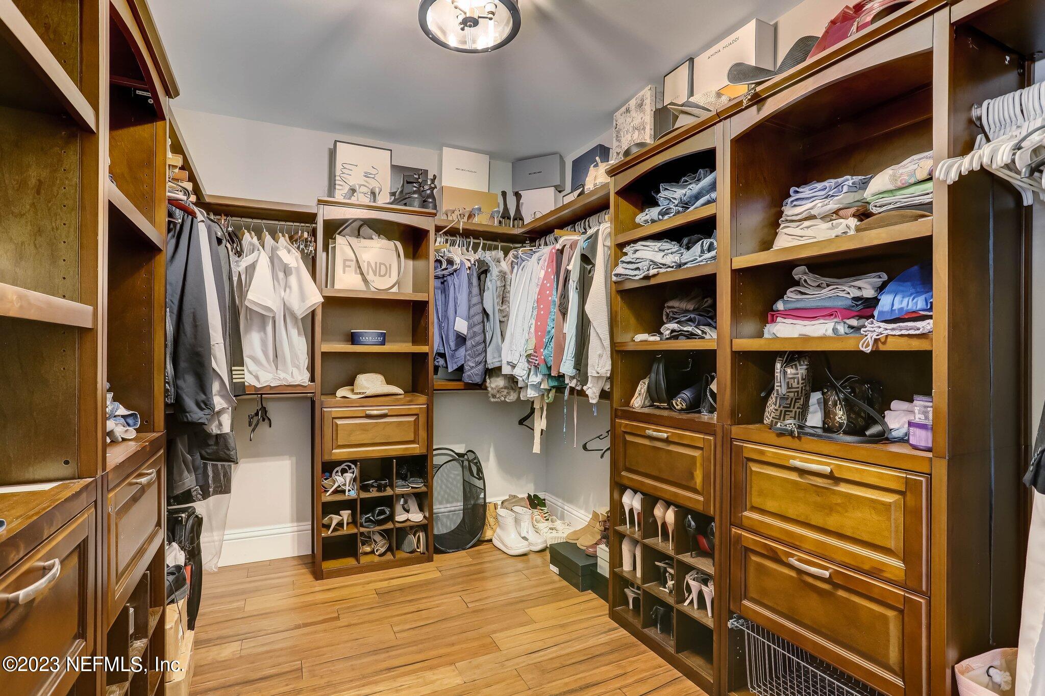 613 Hummingbird Court St. Johns, FL 32259 - Photo 18 of 29 a view of walk in closet with clothes and shoes