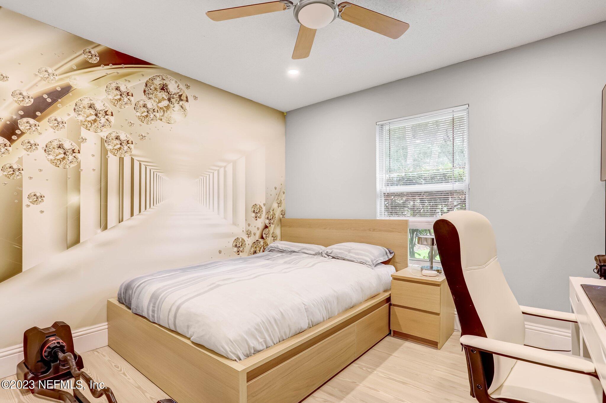 613 Hummingbird Court St. Johns, FL 32259 - Photo 19 of 29 a bedroom with a bed and a dresser next to a window