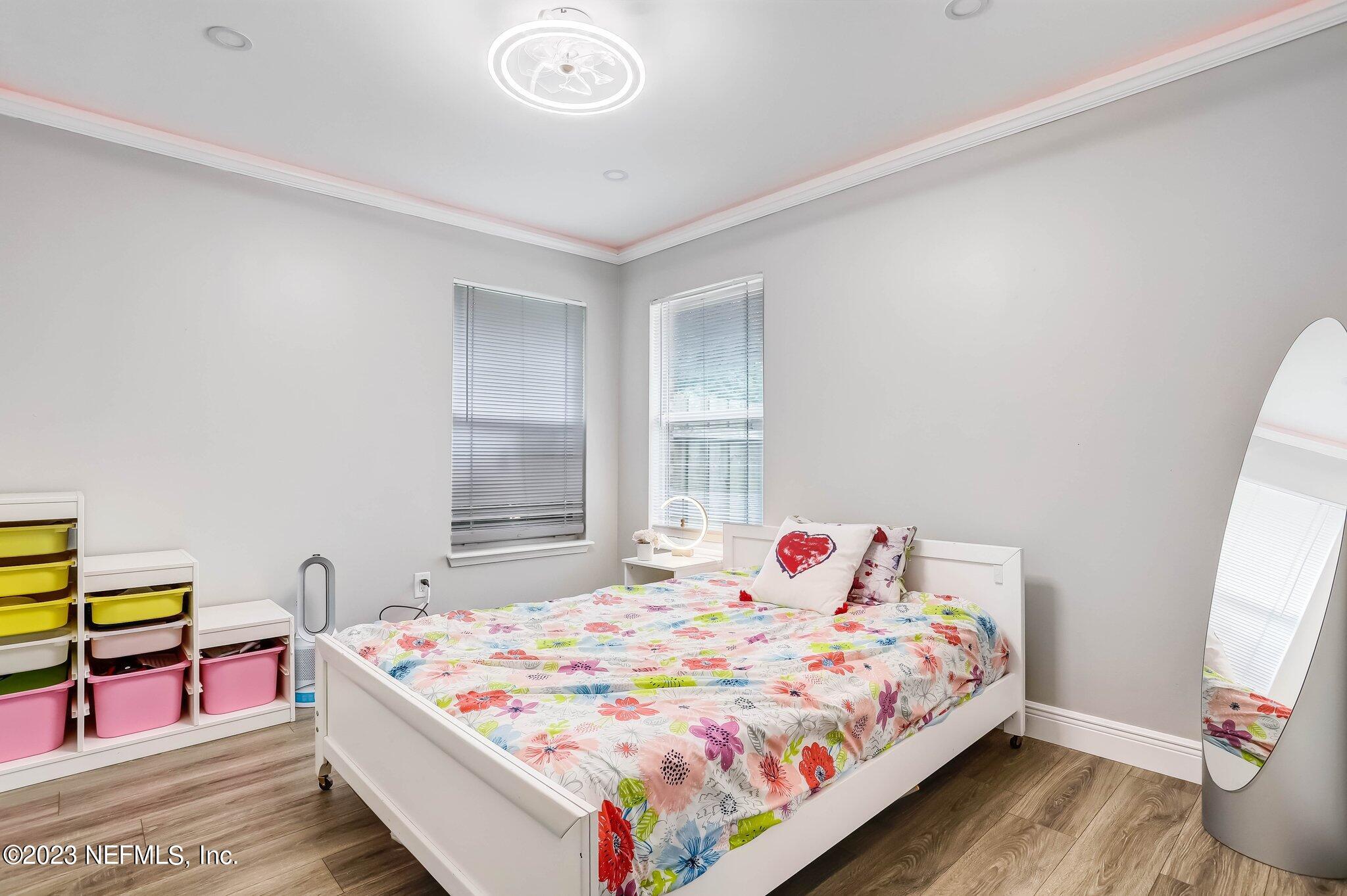 613 Hummingbird Court St. Johns, FL 32259 - Photo 22 of 29 a bedroom with a bed and a window