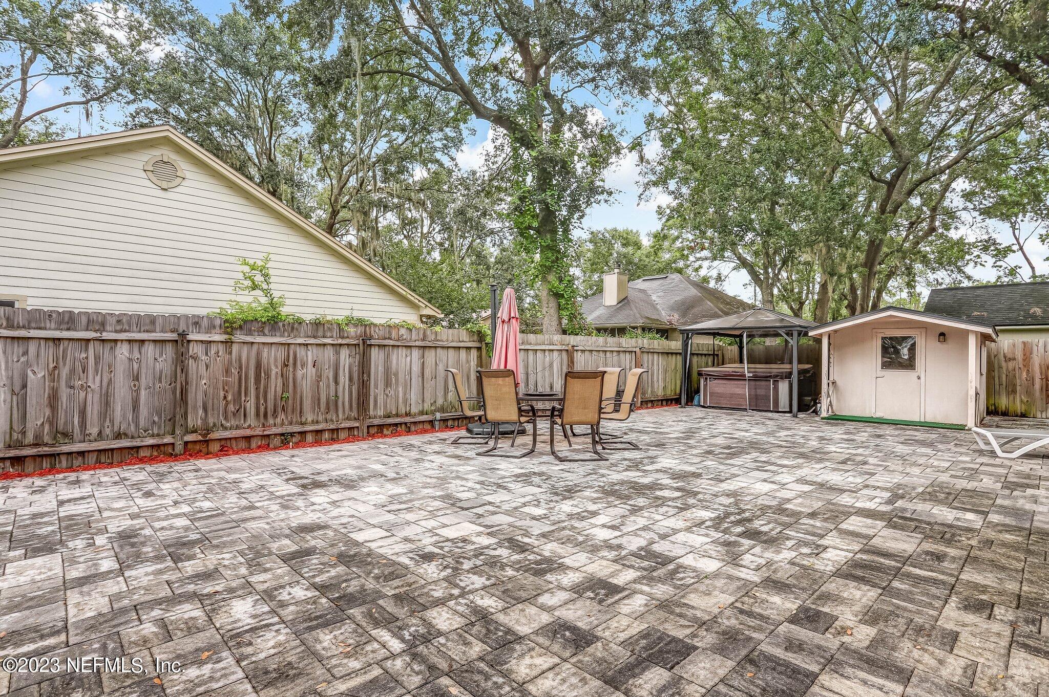 613 Hummingbird Court St. Johns, FL 32259 - Photo 24 of 29 a white house that has a tree in front of it