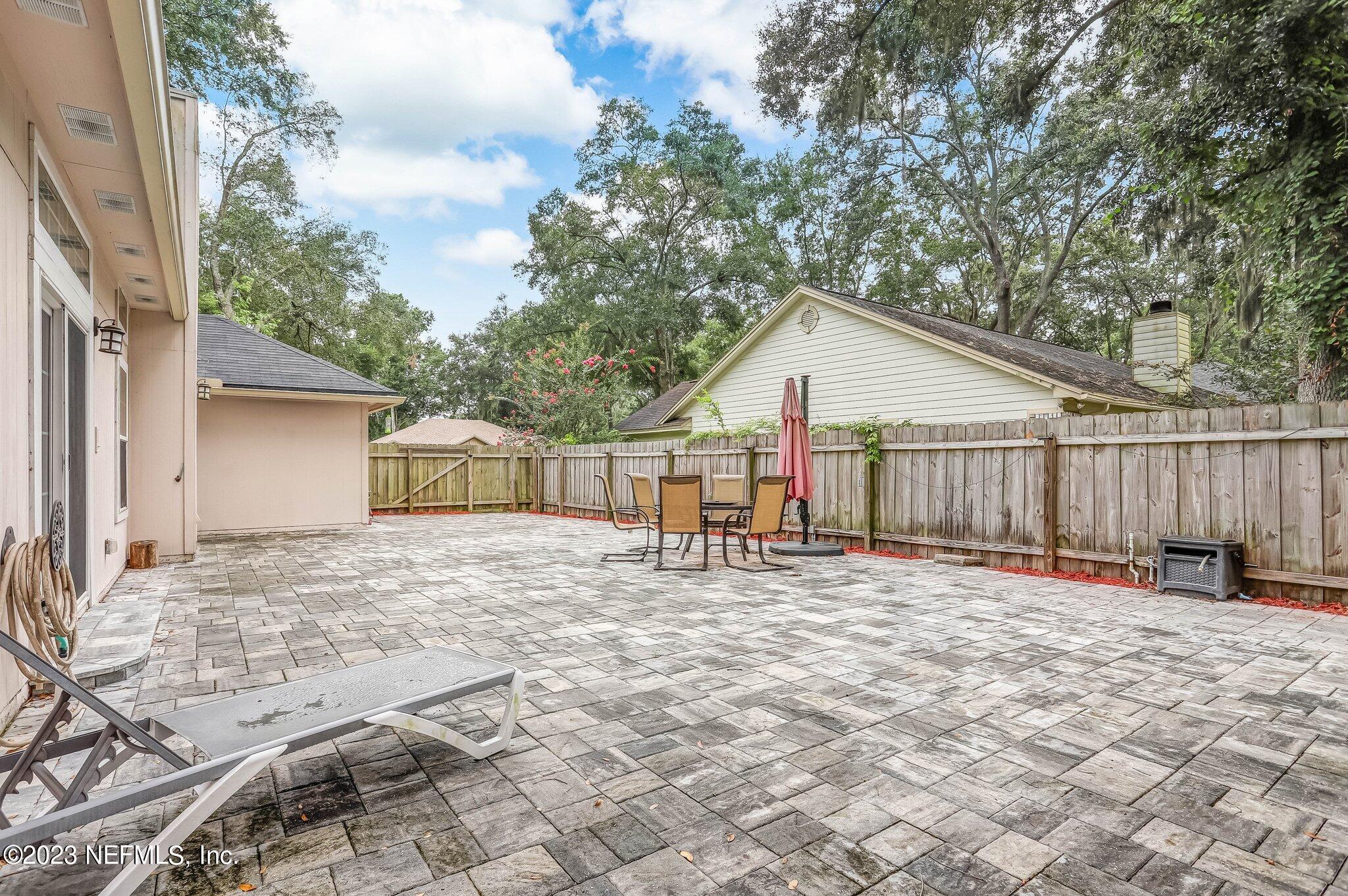 613 Hummingbird Court St. Johns, FL 32259 - Photo 25 of 29 a view of a house with a yard and fence