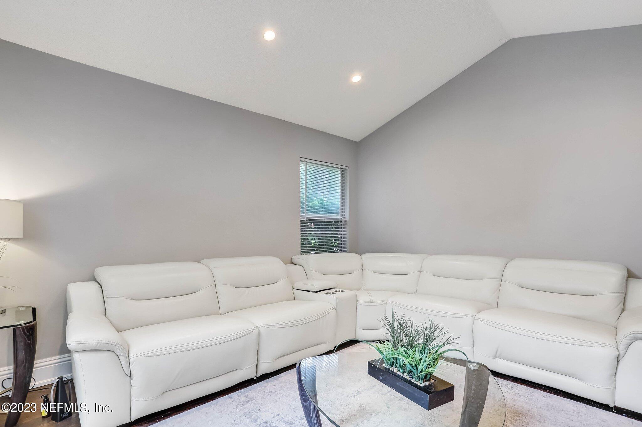 613 Hummingbird Court St. Johns, FL 32259 - Photo 6 of 29 a living room with furniture and a couch