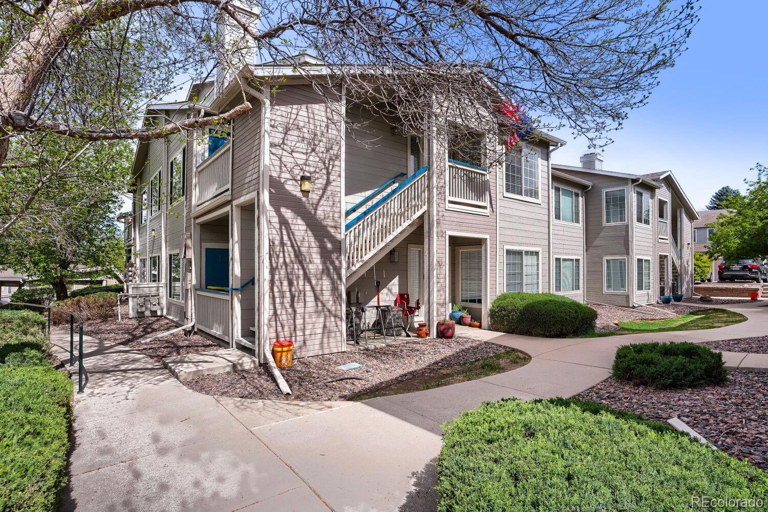 a view of a building with a yard