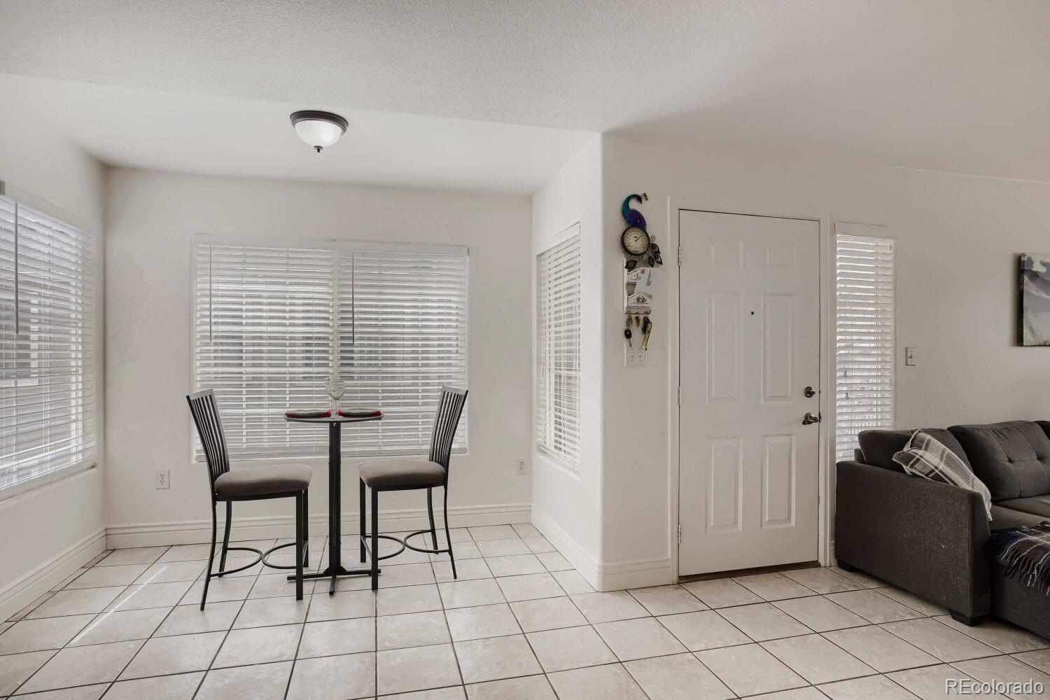 8437 South Thunder Ridge Way, Unit 204 Highlands Ranch, CO 80126 - Photo 8 of 27 a view of a livingroom with furniture