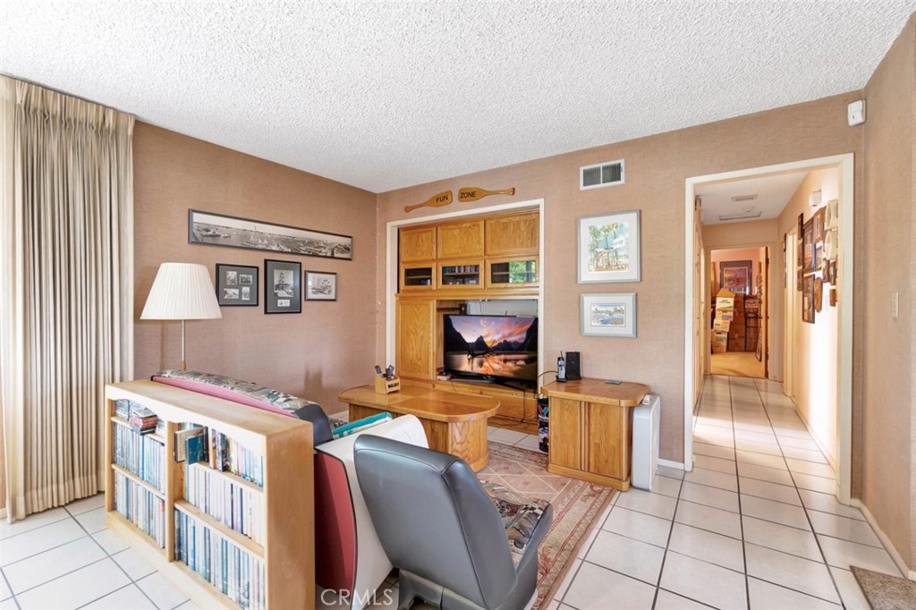 1602 Minorca Drive Costa Mesa, CA 92626 - Photo 11 of 33 a living room with furniture and a flat screen tv