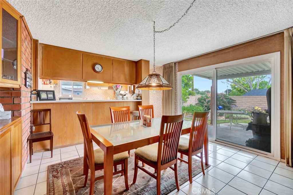 1602 Minorca Drive Costa Mesa, CA 92626 - Photo 14 of 33 a dining room with furniture and window