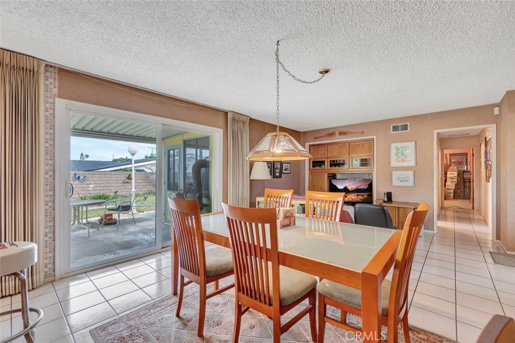 1602 Minorca Drive Costa Mesa, CA 92626 - Photo 16 of 33 a dining room with furniture and window