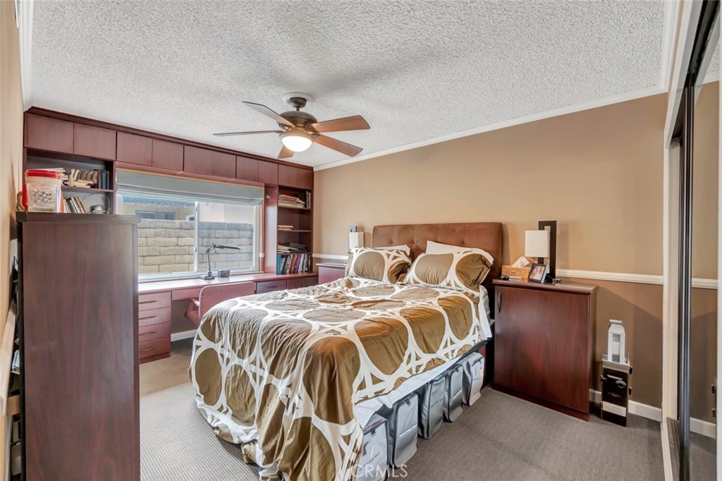 1602 Minorca Drive Costa Mesa, CA 92626 - Photo 23 of 33 a bed sitting in a bedroom next to a window