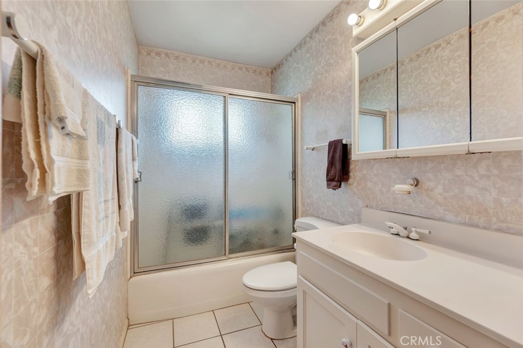 1602 Minorca Drive Costa Mesa, CA 92626 - Photo 24 of 33 a bathroom with a sink a toilet and shower
