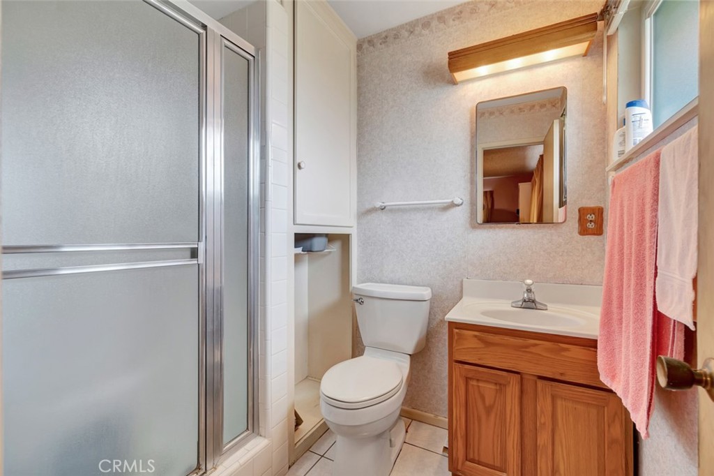 1602 Minorca Drive Costa Mesa, CA 92626 - Photo 25 of 33 a white toilet sitting next to a bathroom sink