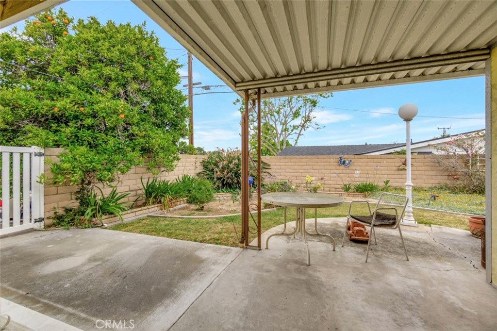 1602 Minorca Drive Costa Mesa, CA 92626 - Photo 26 of 33 a view of a porch with furniture and a yard