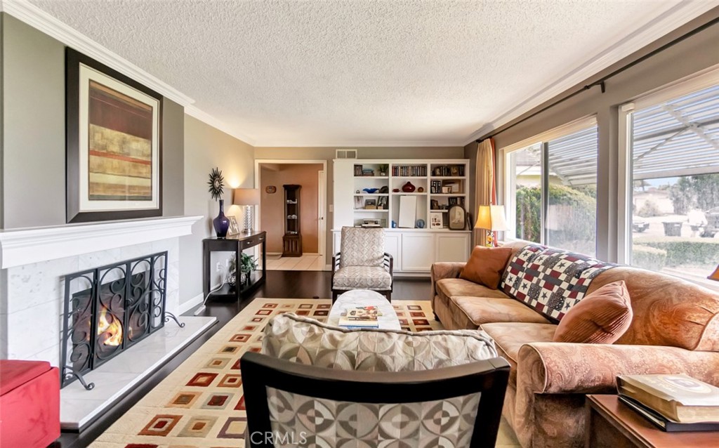 1602 Minorca Drive Costa Mesa, CA 92626 - Photo 6 of 33 a living room with furniture and a fireplace