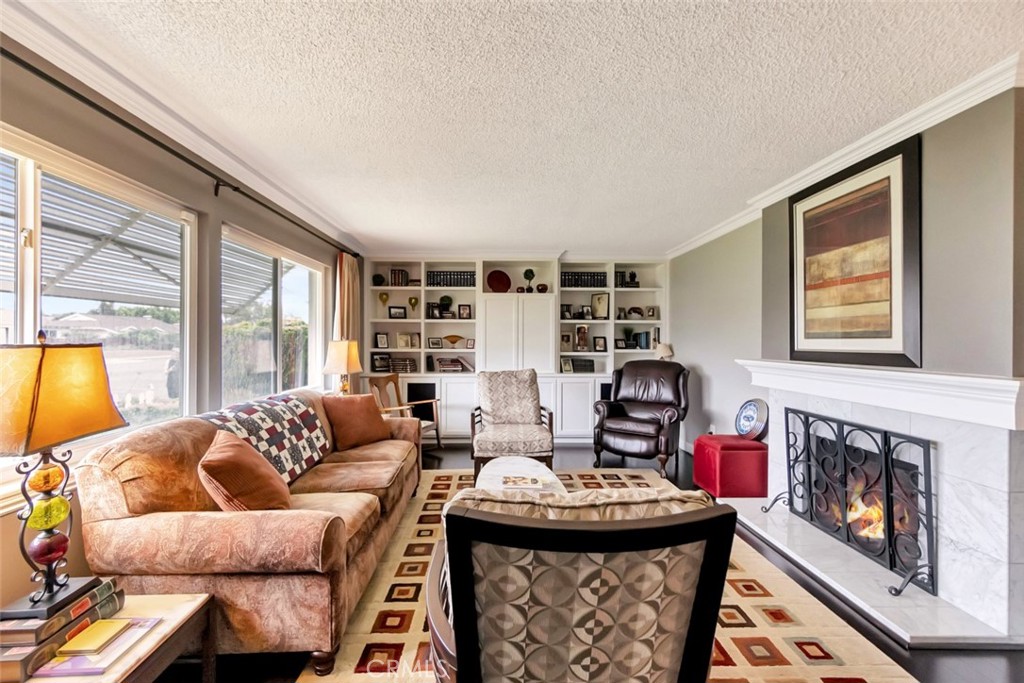 1602 Minorca Drive Costa Mesa, CA 92626 - Photo 7 of 33 a living room with furniture and a fireplace