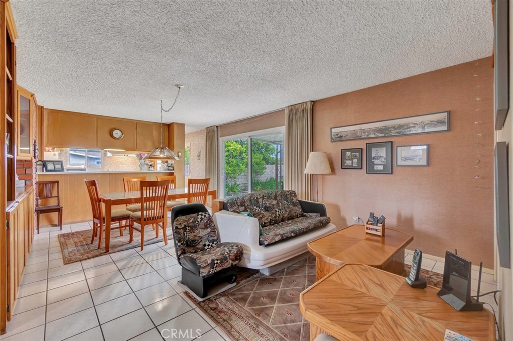 1602 Minorca Drive Costa Mesa, CA 92626 - Photo 10 of 33 a living room with furniture and a large window