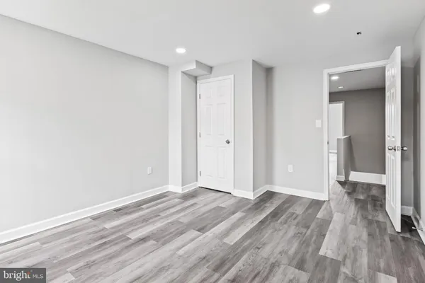 a view of hallway with wooden floor