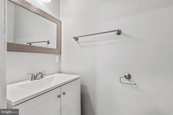a bathroom with a sink and mirror