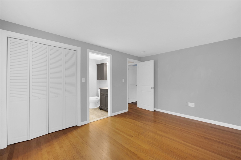 16 Hadley Path West Brookfield, MA 01585 - Photo 17 of 30 a view of an empty room with wooden floor
