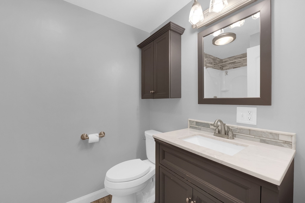 16 Hadley Path West Brookfield, MA 01585 - Photo 18 of 30 a bathroom with a granite countertop sink mirror and toilet
