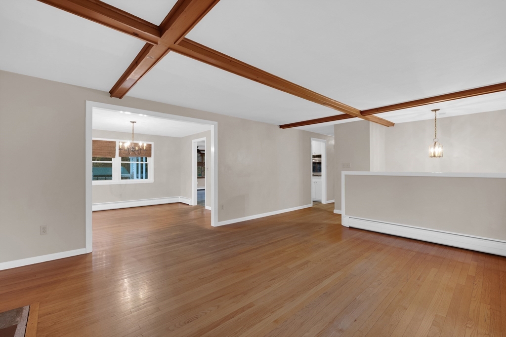 16 Hadley Path West Brookfield, MA 01585 - Photo 5 of 30 a view of an empty room with wooden floor and a window
