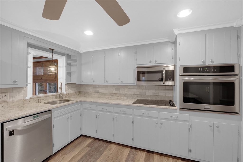 16 Hadley Path West Brookfield, MA 01585 - Photo 10 of 30 a kitchen with stainless steel appliances white cabinets and a sink
