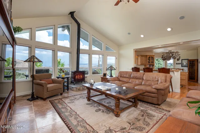 a kitchen with stainless steel appliances granite countertop a lot of counter space and wooden floors