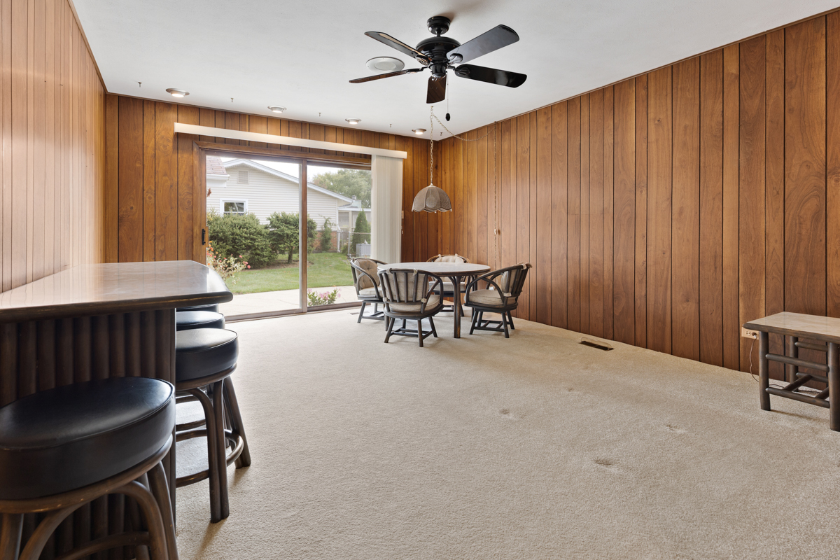 851 Crest Avenue Elk Grove Village, IL 60007 - Photo 11 of 25 a dining room with furniture and window